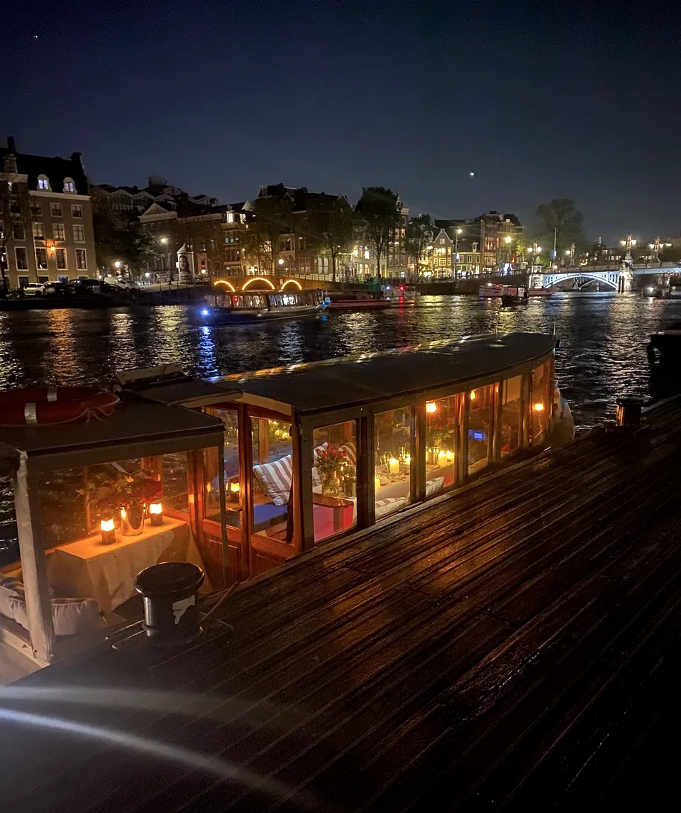 Historic salon boat Energie at night in Amsterdam